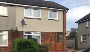 Wall Coating Companies working on exterior property finishes in Scotland, with rendered walls and brickwork on a residential home.