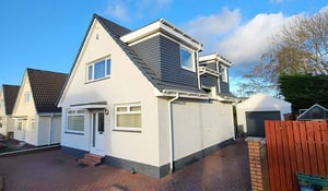 Exterior wall coatings on a Scottish home, showing a light-coloured rendered finish designed to protect the exterior from harsh weather.